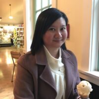 Dr. Renee Tan, a psychiatrist in Malaysia, enjoying ice cream at a café.