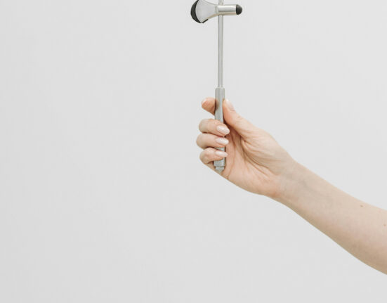 Doctor Holding a Hammer