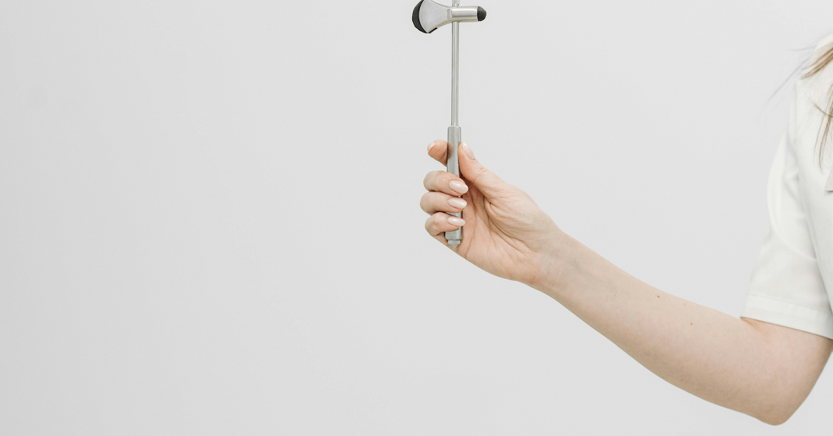 Doctor Holding a Hammer