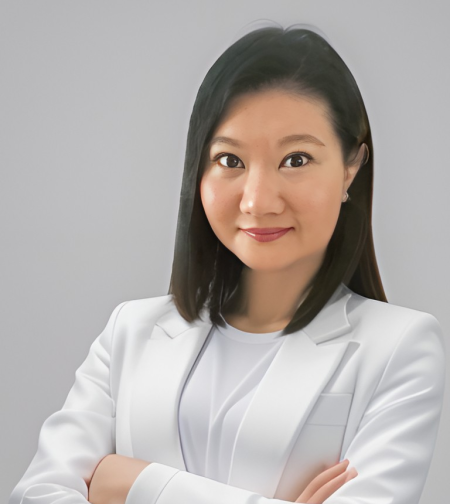 Dr. Renee Tan, psychiatrist in Malaysia, wearing a white blazer with a confident expression.