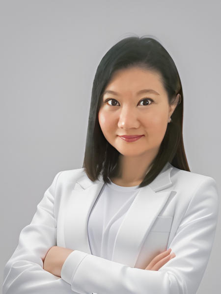 Dr. Renee Tan, psychiatrist in Malaysia, wearing a white blazer with a confident expression.