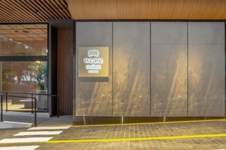 Weave Living Weave Suites Sign